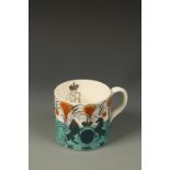 ERIC RAVILIOUS FOR WEDGWOOD: A GEORGE VI 1937 CORONATION MUG in a turquoise and orange colourway,
