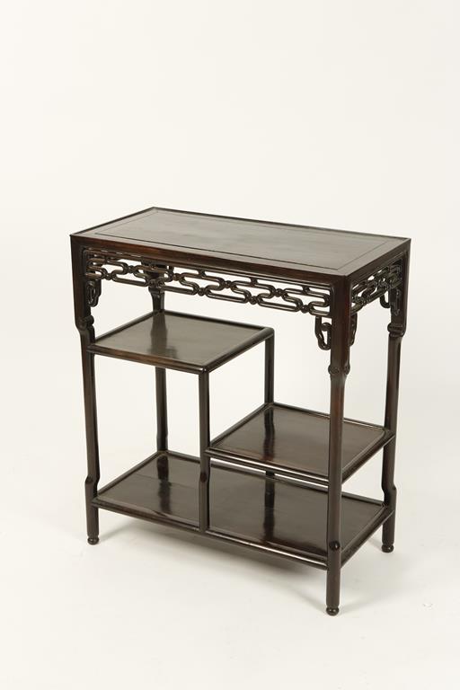 A CHINESE HARDWOOD SIDE TABLE, the rectangular top above asymmetric shelves with pierced and