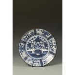 A JAPANESE ARITA BLUE AND WHITE DISH decorated with flowers, Edo, 17th/18thC, 12.5" dia.