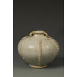 A CHINESE QINGBAI SMALL JAR with relief borders, Song/Yuan, 4" dia.