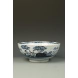 A DELFT BOWL, loosely decorated in blue, with a tree and building in the distance, 18th century,