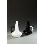 ALFREDO BARBINI: TWO SIMILAR JUGS, with white body and dark handle and red body and white handle,