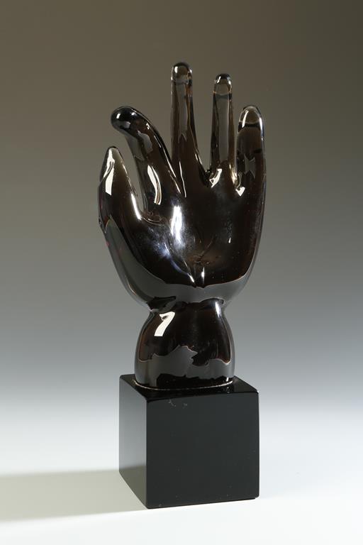 ALFREDO BARBINI: A SMOKY BROWN GLASS SCULPTURE OF A HAND, apparently designed by Napoleone