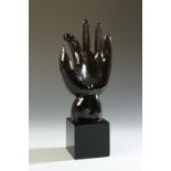 ALFREDO BARBINI: A SMOKY BROWN GLASS SCULPTURE OF A HAND, apparently designed by Napoleone
