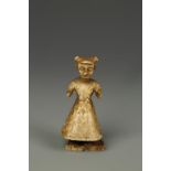 A MINIATURE IVORY IDOL FIGURE, probably African, with painted details, 19th century, 2" high