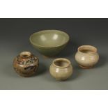 A KOREAN CELADON BOWL AND THREE SMALL JARS, one with underglaze blue decoration, the bowl 6" dia. (