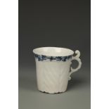 A WORCESTER BLUE AND WHITE PORCELAIN COFFEE CAN, herringbone moulded with flared rim and scroll