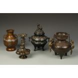 FOUR ORIENTAL BRONZE VESSELS, including a hanging censer, a champleve censer, and two vases, 19th