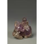 A CHINESE AMETHYST BOY AND BUFFALO CARVING, probably Qing, 2.5" long