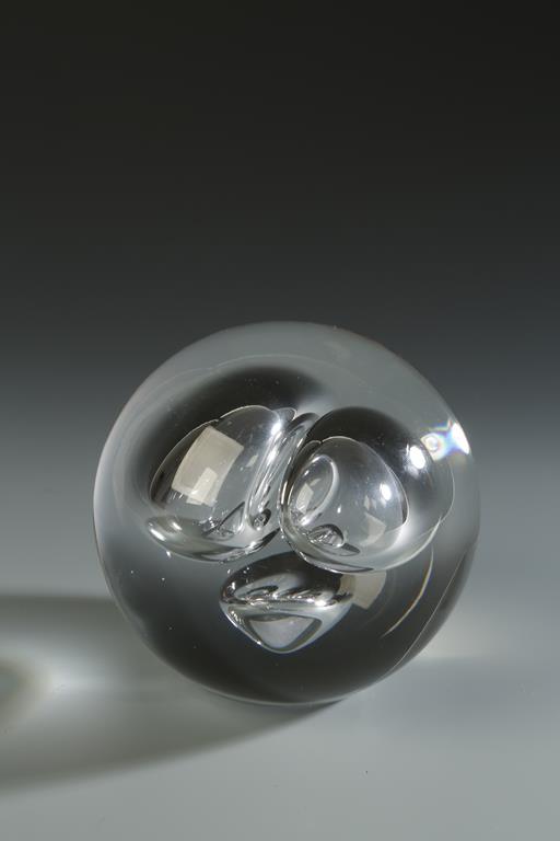 BARBINI: A CLEAR GLASS PAPER WEIGHT, with three bubble inclusions, signed 'Barbini Murano', 4" dia.