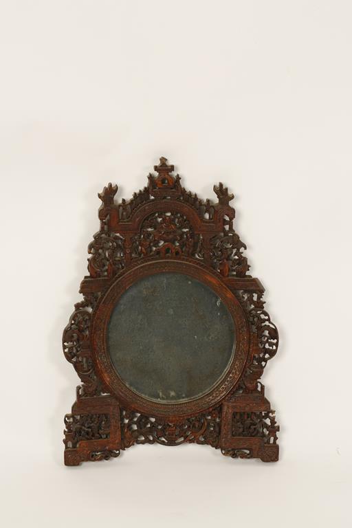 A CHINESE HARDWOOD MIRROR carved with figures and foliage, Qing, 19thC, 17.5" high