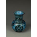 A PERSIAN TURQUOISE-GLAZED VASE, of rounded form, with floral decoration, 5" high
