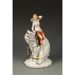 KATZHUTTE: A PORCELAIN MODEL OF A NUDE RIDING A POLAR BEAR with painted highlights and a floral