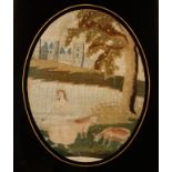 A SILK WORK PICTURE of a milkmaid with two cows in a landscape with a lake and castle to the