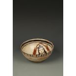 A POLYCHROME BOWL, decorated with a figure, probably Afghanistan, 7.75" dia.