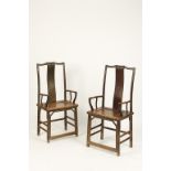 A PAIR OF CHINESE "THRONE" CHAIRS with shaped arm rests and solid seats, Qing, 46" high (2). See