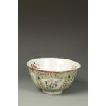 A CHINESE FAMILLE JAUNE BOWL decorated with panels of birds and insects amongst flowers, Qing,
