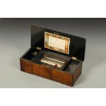 A SWISS MUSIC BOX, playing eight aires, in a walnut case, Victorian, 17" wide