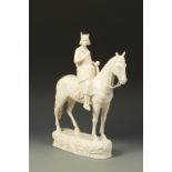 KATZHUTTE HERTWIG: A BLANC DE CHINE EARTHENWARE FIGURE OF A MEDIEVAL MAN RIDING A HORSE with green