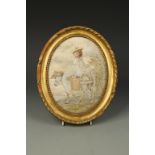 A GEORGE III SILKWORK PICTURE of a young girl riding on a donkey, 9" x 7".  Provenance: The