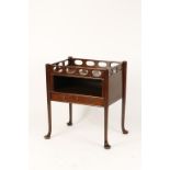 A MAHOGANY BEDSIDE COMMODE with pierced frieze and single drawer, on turned legs with pad feet, 18th
