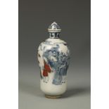 A CHINESE UNDERGLAZED-BLUE AND RED SNUFF BOTTLE, decorated with figures in a garden, Qianlong