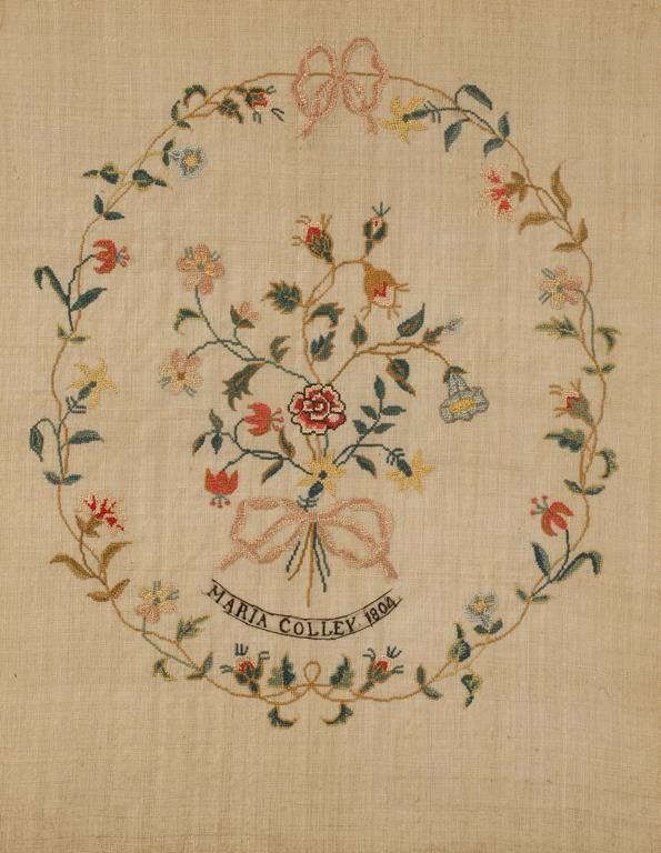 A NEEDLEWORK PICTURE, signed Maria Colley, 1804, worked with a central bouquet within a ribbon-