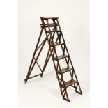 A PAIR OF TALL BRASS-LIPPED FOLDING STEPS, 54.5" high