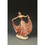 STEFFL: AN EARTHENWARE FIGURE OF A LADY, holding aloft her ball gown, in pink and black on an oval
