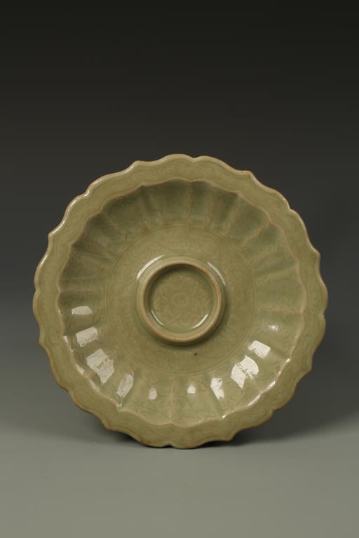 A CHINESE LONGQUAN CELADON CUP STAND of foliate form, probably Yuan, 8.25" dia.