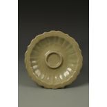 A CHINESE LONGQUAN CELADON CUP STAND of foliate form, probably Yuan, 8.25" dia.