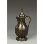 A NIELLO-DECORATED EWER, Eastern European or Russian, decorated with scrolling foliage, 9" high