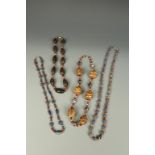 FOUR BEAD NECKLACES, probably Afghanistan, in coloured stones and glass (4)