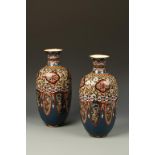 A PAIR OF JAPANESE CLOISONNE QUATREFOIL VASES, decorated with panels and ginbari work, Meiji, 14"