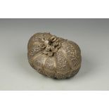 A PERSIAN SILVER GOURD-SHAPED BOX, with repousse foliate decoration, 5" long
