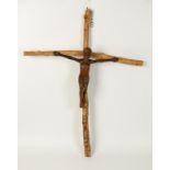 A SCULPTURAL STUDY OF THE CRUCIFIX, the body of Christ carved in hardwood on a simple birch cross,