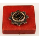A NAZI THIRD REICH GERMAN CROSS MEDAL, in silver, stamped '20' on pin reverse, contained in case.