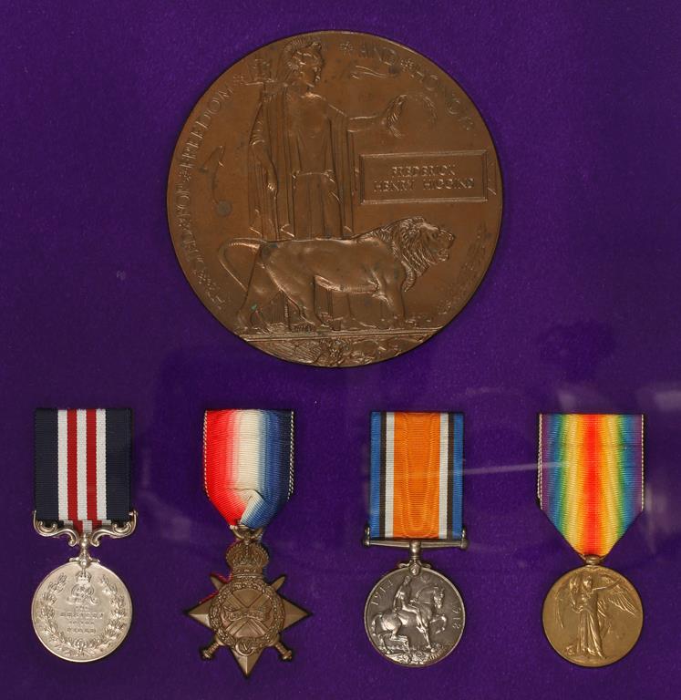 A GREAT WAR M.M. AND TRIO OF MEDALS WITH PLAQUE, awarded to Corporal Frederick Henry Higgins, 5th