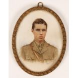 A FIRST WORLD WAR PERIOD MINIATURE PORTRAIT of a young soldier in uniform, in a gilt brass frame, 4"