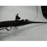 AN EASTERN SPORTING RIFLE, with ivory inlaid decoration, 64"