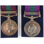 A GENERAL SERVICE MEDAL 1918-32 WITH IRAQ CLASP, (293039 GNR. G.W. MOULAND. R.A.), and a G.S.M.