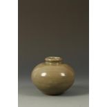 A CHINESE LONGQUAN CELADON OVOID VASE with a spreading lip, rounded body and unglazed foot, Yuan -