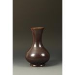 A CHINESE 'IRON-DUST' GLAZED VASE of baluster form, the fine glaze suffused with tiny metallic