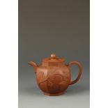 A CHINESE YIXING OCTAGONAL TEAPOT, the cover with a faceted finial surrounded by relief cloud