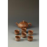 A CHINESE YIXING TEAPOT AND SIX CUPS of lotus form, signed Zhong-zuo meizhi, late Qing-Republic, the