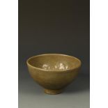 A CHINESE CELADON DEEP BOWL, probably Longquan, the interior with a mould-pressed band of figures,