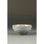 A FINE SMALL CHINESE JUNYAO 'BUBBLE' BOWL, the steep sides of gently rounded form, the thick glaze