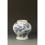 A CHINESE BLUE AND WHITE BALUSTER VASE decorated with a butterfly, blossoming foliage and rocks,