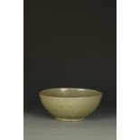 A CHINESE LONGQUAN CELADON BOWL, the centre with a moulded chrysanthemum flower within a stylised