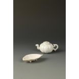 A CHINESE WHITE-GLAZED MINIATURE EWER of segmented form, Qing Dynasty, 18th/19th century, 10cm long;
